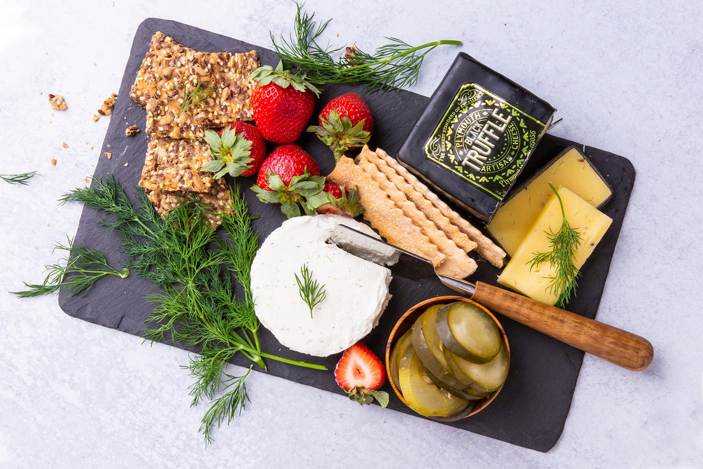 Black Truffle Cheddar Cheese by Plymouth Artisan Cheese in Plymouth