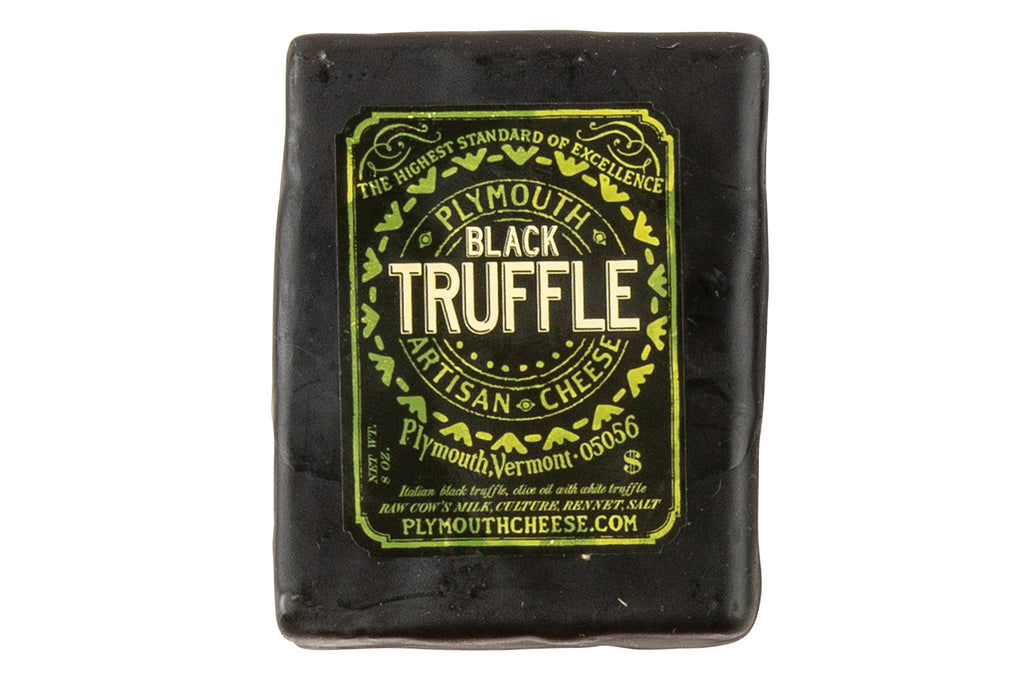 Black Truffle Cheddar Cheese by Plymouth Artisan Cheese in Plymouth